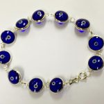 Pulsera plata ojos turcos azules