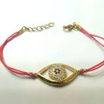 Ojo turco latón baño oro cristal austríaco 2.