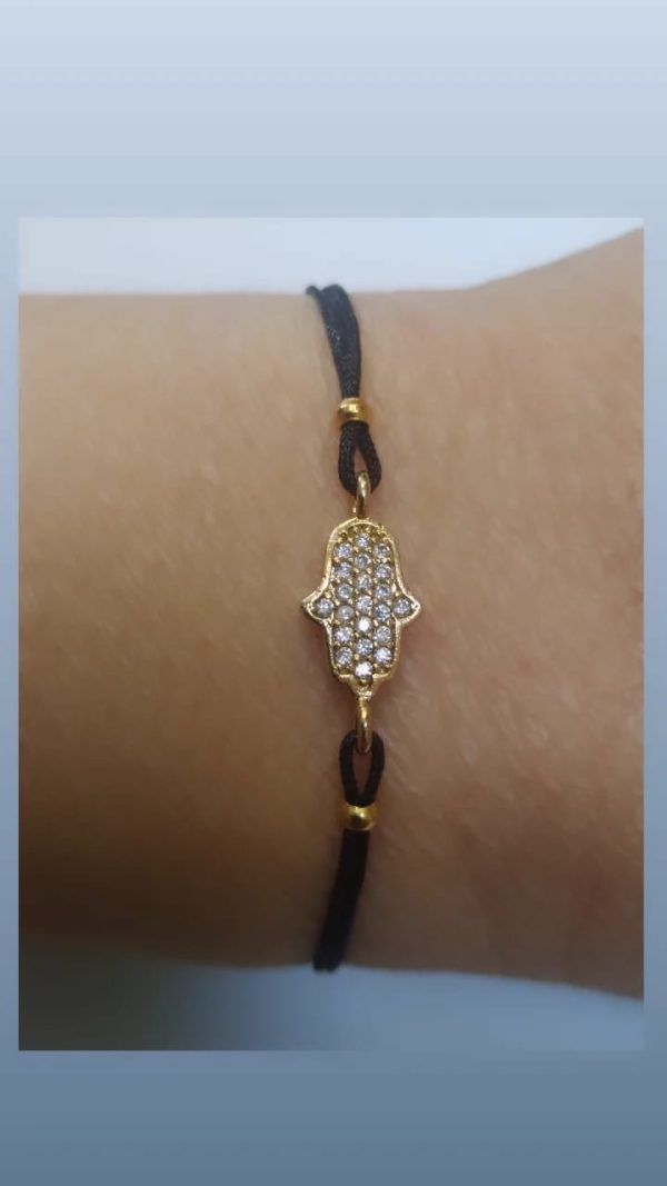Mano de Fátima latón baño oro cristal austríaco, negra.
